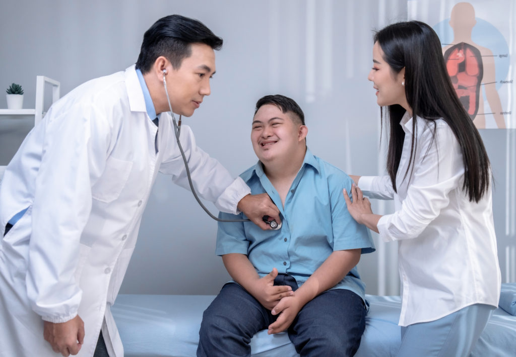 boy with down syndrome at the doctor